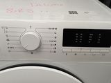 a washing machine that is sitting on the floor