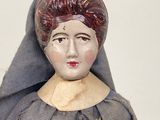 a figurine of a woman with a veil on her head