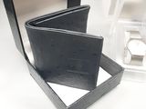 a small black box with a watch inside of it