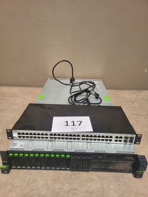 a close up of a rack of switches with wires on top of it