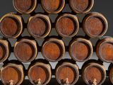 several wooden barrels stacked on top of each other in a room
