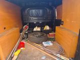 the back of a van with tools in the back of it