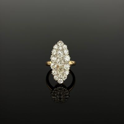 an 18k gold and diamond cluster ring