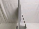 a computer monitor sitting on top of a white table