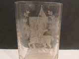 a glass with a picture of a knight riding a horse