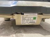 a machine that is sitting on the ground with a label on it