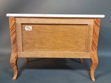 an image of a small wooden chest with a marble top