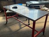 a table that has a printer on it in a room