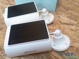 two speakers that are sitting on top of a table