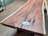 a wooden table with a number on it in the middle of a room