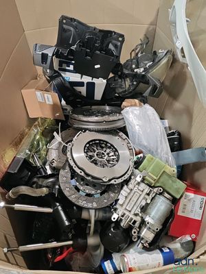 a cardboard box full of assorted items in it