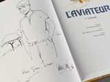 a book with a drawing of a man standing in front of a plane