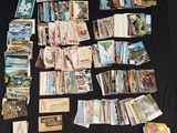 many cards laid out on a table with a black background