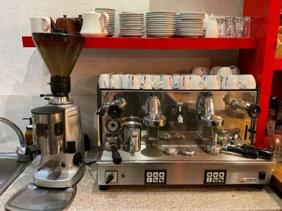 a picture of a coffee machine on a counter in a kitchen
