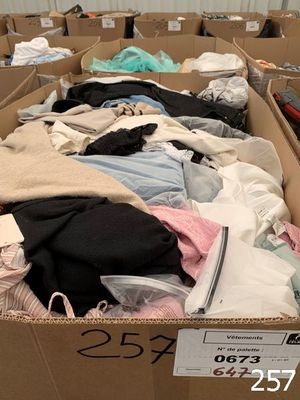 many boxes of clothes that are in a store