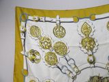 a yellow and white scarf with a picture of a horse and carriage