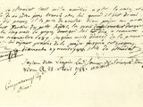 une vieille lettre écrite à l'encre noire sur un bout de papier