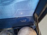 a close up view of a blue suitcase with a silver lid