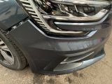 a close up of a car ' s headlight and front bumper