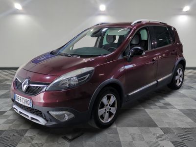 a picture of a burgundy colored car parked in a garage