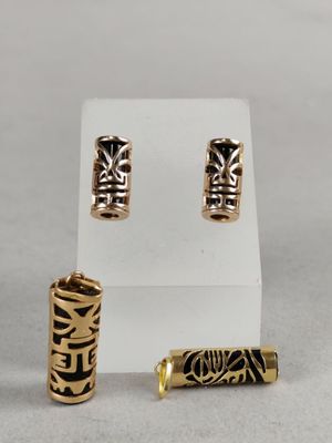 a close up of three different pieces of jewelry on a white surface