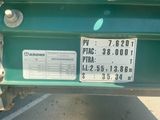 a license plate on the back of a green truck