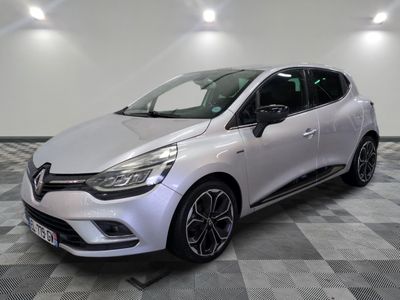 a white car parked in a room with a checkered floor