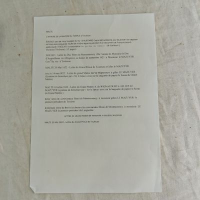 a piece of paper on the table with a piece of paper attached to it