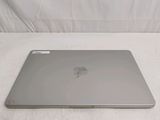 a silver apple laptop sitting on a white surface