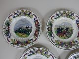 three plates with a picture of a group of people on them