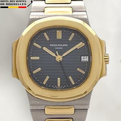 an image of a gold and silver wrist watch with a black dial