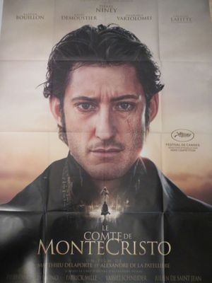 affiche de film représentant un homme qui regarde fixement la caméra devant un ciel nuageux