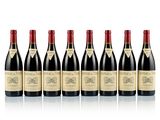 six bottles of red wine lined up in a row