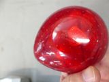 a person holding a red apple in their hand