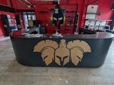 a black and gold counter in a room with red walls