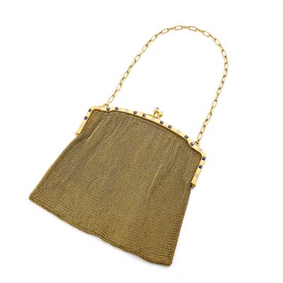 a gold mesh purse with a chain handle