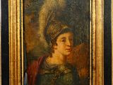 portrait d'un jeune homme dans un cadre doré, avec une couronne sur la tête