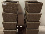 several wicker baskets stacked on top of a wooden pallet