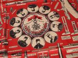 a red table cloth with a bunch of different items on it