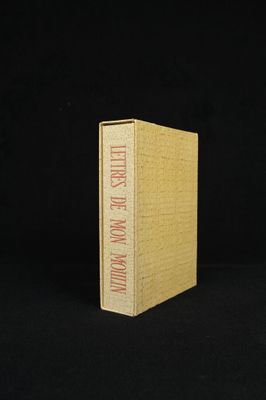 a book with a yellow cover sitting on top of a black surface
