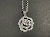 an image of a necklace with a smiley face made out of diamonds