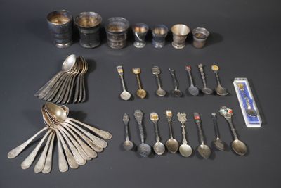 many spoons and silverware on the table