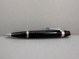 an image of a pen with a black body and silver trim
