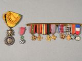 a row of medals and medals hanging on a wall