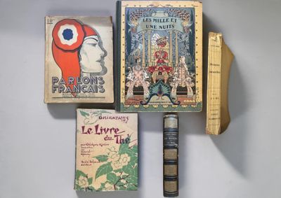 three books that are sitting on a wall