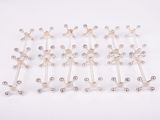 a close up of a bunch of silver balls on a white surface