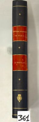 a black and red book on display with a price tag