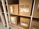 many boxes that are on a shelf in a room