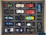 a box with a variety of toy cars in it