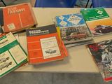 a table with many books on it that are sitting on the table